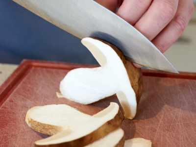Hands Cutting Mushrooms